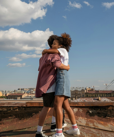 Adolescent couple hugging Adolescent couple hugging