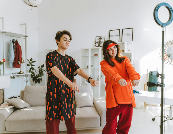 Adolescent girl and boy making dance video Adolescent girl and boy making dance video