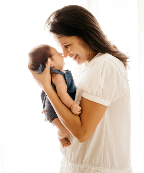 Happy mother holding her newborn baby Happy mother holding her newborn baby