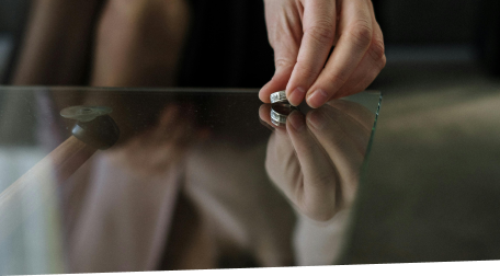 Women placing her wedding ring on a table