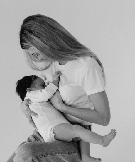 Black and white photo of mother feeding baby Black and white photo of mother feeding baby